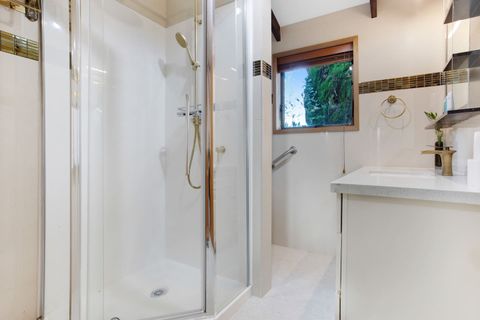 The main family bathroom has a bidet toilet, shower and vanity unit.