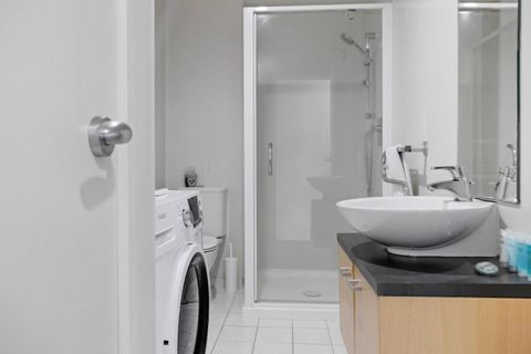 The bathroom has a shower, toilet, vanity and heated towel rail.