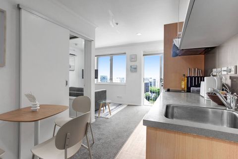 The open-plan living area consists of lounge, dining and kitchen.