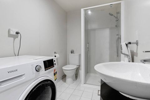 There is a handy combo dryer/washing machine in the bathroom.