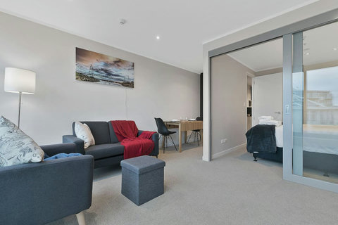 The open-plan living area consists of the lounge and dining table.