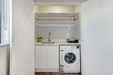 This is an extension of the kitchenette with the sink and extra cupboard space.