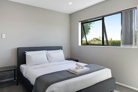 There is plenty of natural light that streams into the bedroom through the windows.