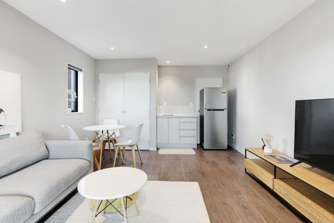 Relax on the couch and watch TV or read a book.