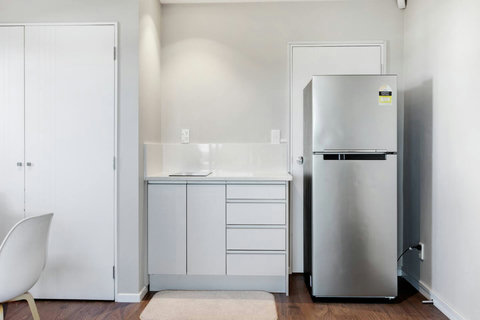 The kitchenette has a 2 burner cooktop, microwave, fridge/freezer, toaster and kettle.