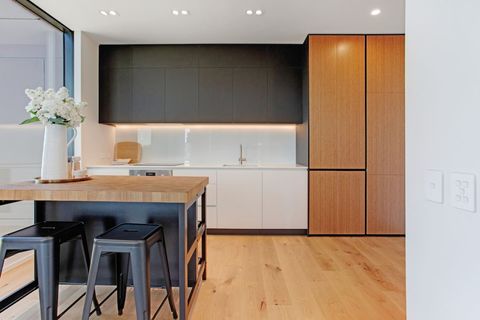 The kitchen has a cooktop, oven, microwave, toaster, kettle and dishwasher.