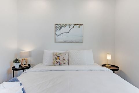 The artwork in the bedroom reflects the landscape outside.