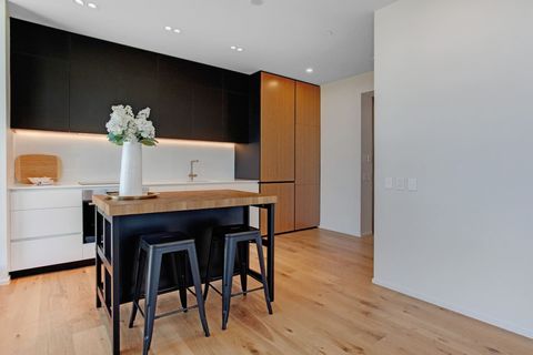 There is a handy kitchen island that doubles as a casual breakfast bar seating area.