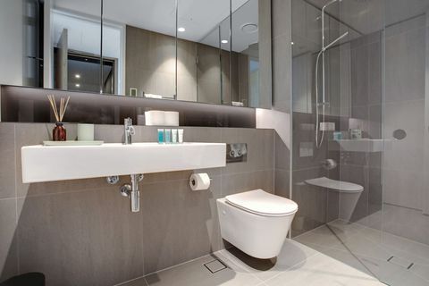 The bathroom has a shower, toilet and basin plus lots of storage in the mirrored cupboards.