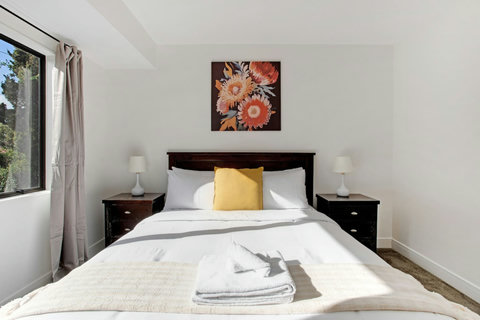 The main bedroom has a walk-in wardrobe and ensuite bathroom.