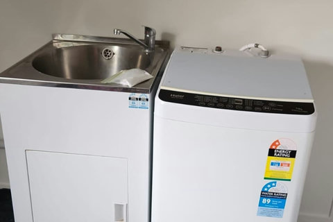 There is a handy washing machine in the garage area.