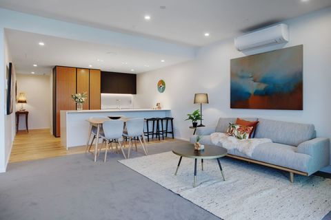 The open-plan living space has great natural light and stunning views across Catalina Bay.