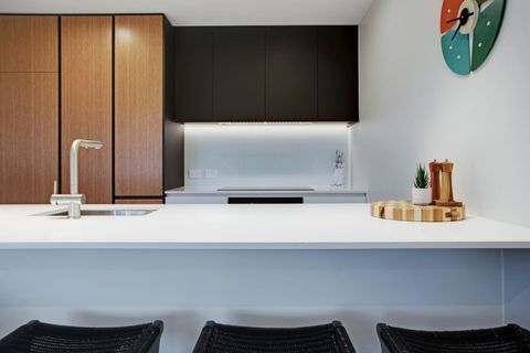 There is a handy kitchen island that doubles as a casual breakfast bar seating area.