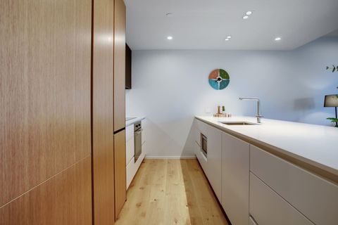 The kitchen has a cooktop, oven, microwave, toaster, kettle and dishwasher.