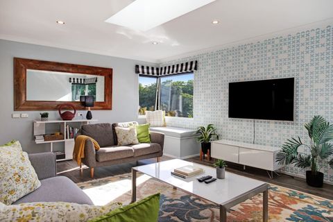 Relax on the couch and watch TV or read a book.