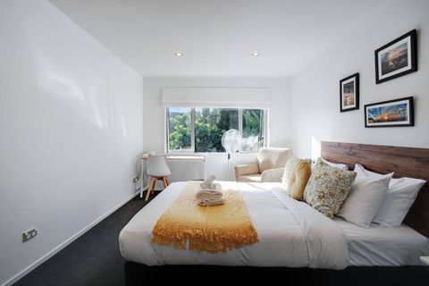 The Queen bedroom exudes a restful atmosphere with its soft spring colours of orange and florals.
