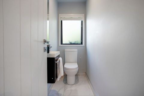 The toilet is separate from the main bathroom which is handy for families.