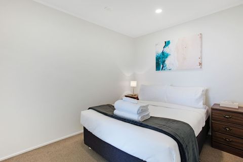 The bright colourful artwork adds a pop of colour to the bedroom.