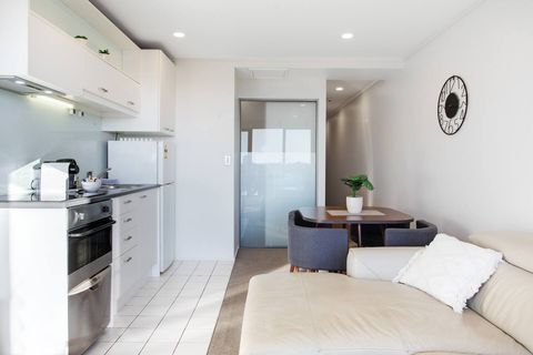 The open-plan living space includes the kitchen, dining and lounge area.