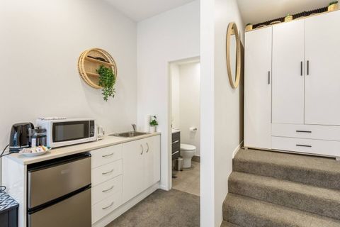 You can easily reheat a microwave meal in this kitchenette.