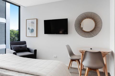 The chair in the corner, can be set up as a sofa bed for a child.