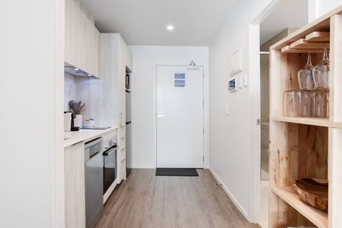 When you enter the apartment, the kitchen is on the right and bathroom on the left.