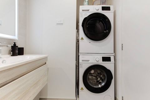 There is a washing machine and dryer in the bathroom area, which is great for longer stays.