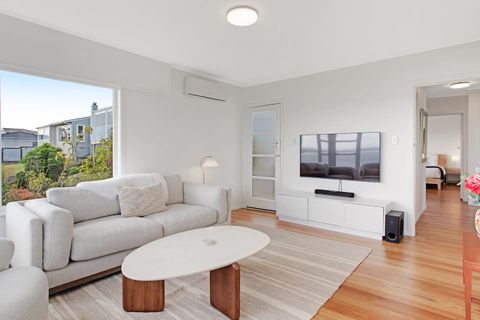 There is a smart TV on the wall, so you can watch your own streaming service.