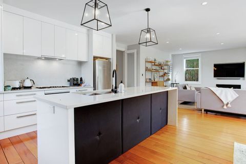 The kitchen has a gas cooktop, oven, dishwasher, microwave and fridge/freezer.