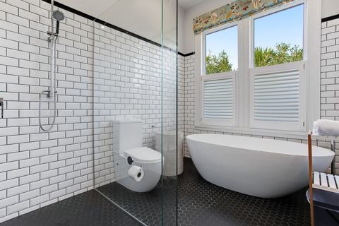 The main family bathroom has both a shower and bath-tub.