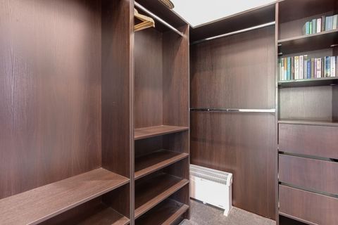 There is plenty of storage in the walk-in wardrobe.