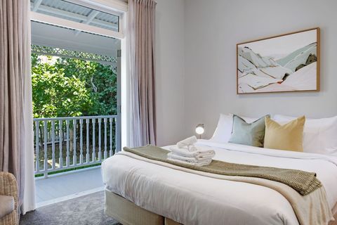 Open the French doors to enjoy the indoor/outdoor flow onto the balcony.