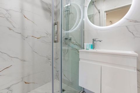 The downstairs bathroom also has a shower, toilet and vanity unit.