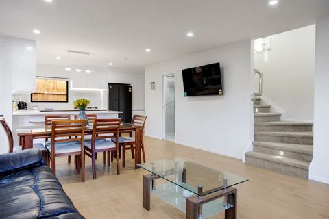 The stairs leading up to the bedroom level.
