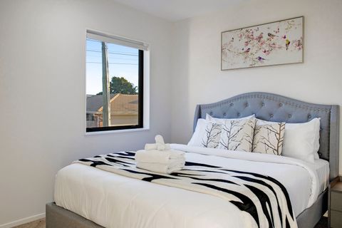 There is pretty flowers on the wall that matches the cushions.