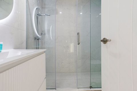 The family bathroom has a shower, vanity and toilet.