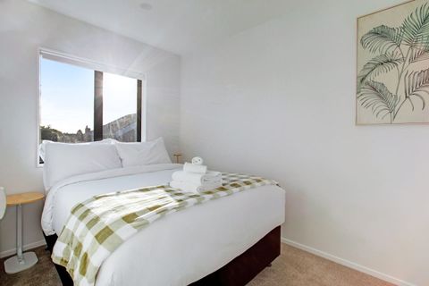 The green throw matches the artwork on the wall.