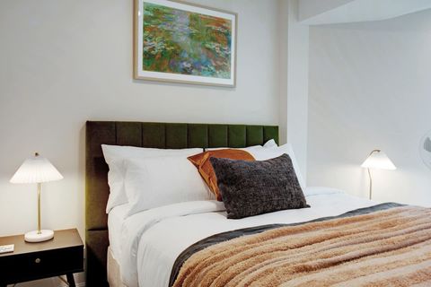 There is artwork throughout the apartment that adds interest to the walls.