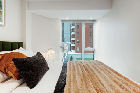 There are floor-to-ceiling windows in the Queen main bedroom.