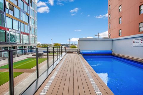 The swimming pool is beside the courtyard area.
