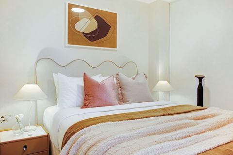 There is artwork throughout the apartment that adds interest to the walls.