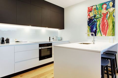 The kitchen has a cooktop, oven, microwave, toaster, kettle and dishwasher.