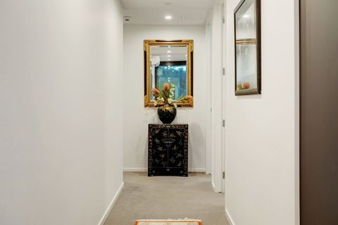 The bedroom is located off the hallway with the living spaces at the front.