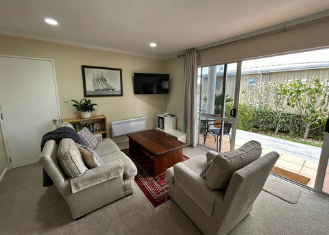 Relax on the couch and watch TV or read a book.