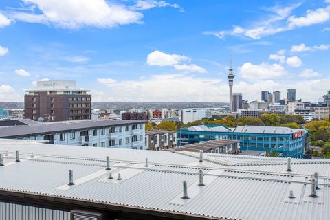 View over the rooftops towards SkyTower and the high rises in the distance.