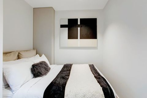 The artwork matches the throw, cushions and sheets in the bedroom.