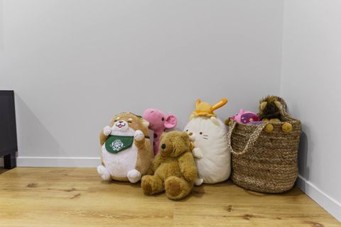 There are some stuffed toys just waiting for a child to play with them.