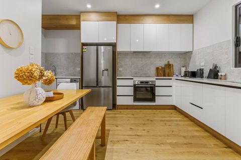 The dining table is located in the kitchen area - handy for meals.