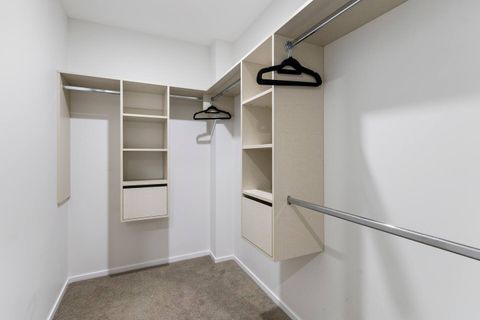 The walk-in wardrobe has plenty of room to hang your clothes and store your suitcases.