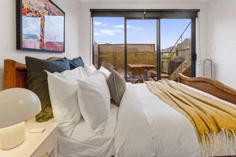 The king bed on the ground floor, has ranch slider that opens onto the patio.